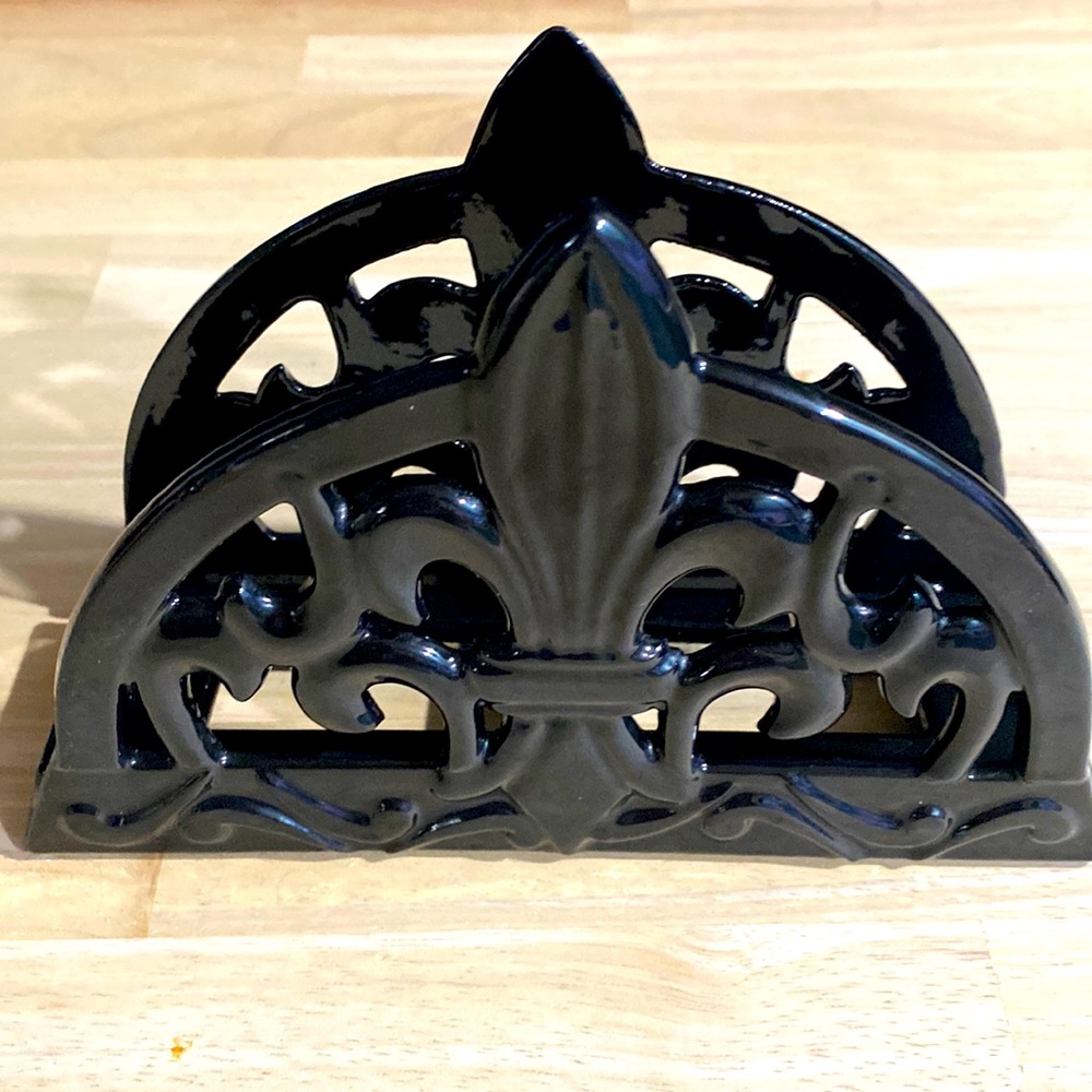 Fleur De Lis metal with a black ceramic coating.
